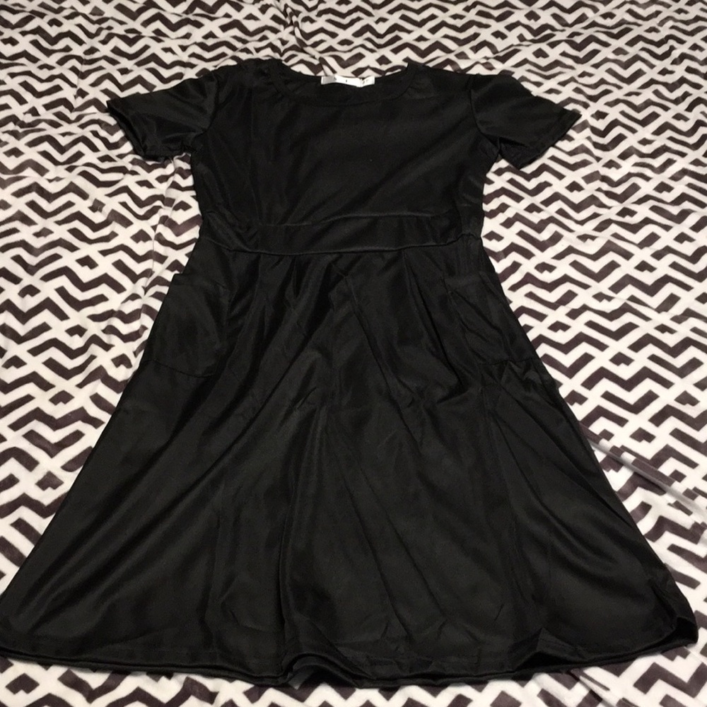 Women’s black dress with side pockets